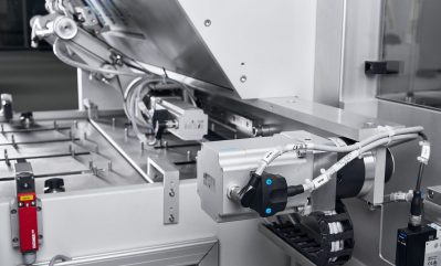 Mechanical drive unit with sensors and linear guide in a packaging machine.